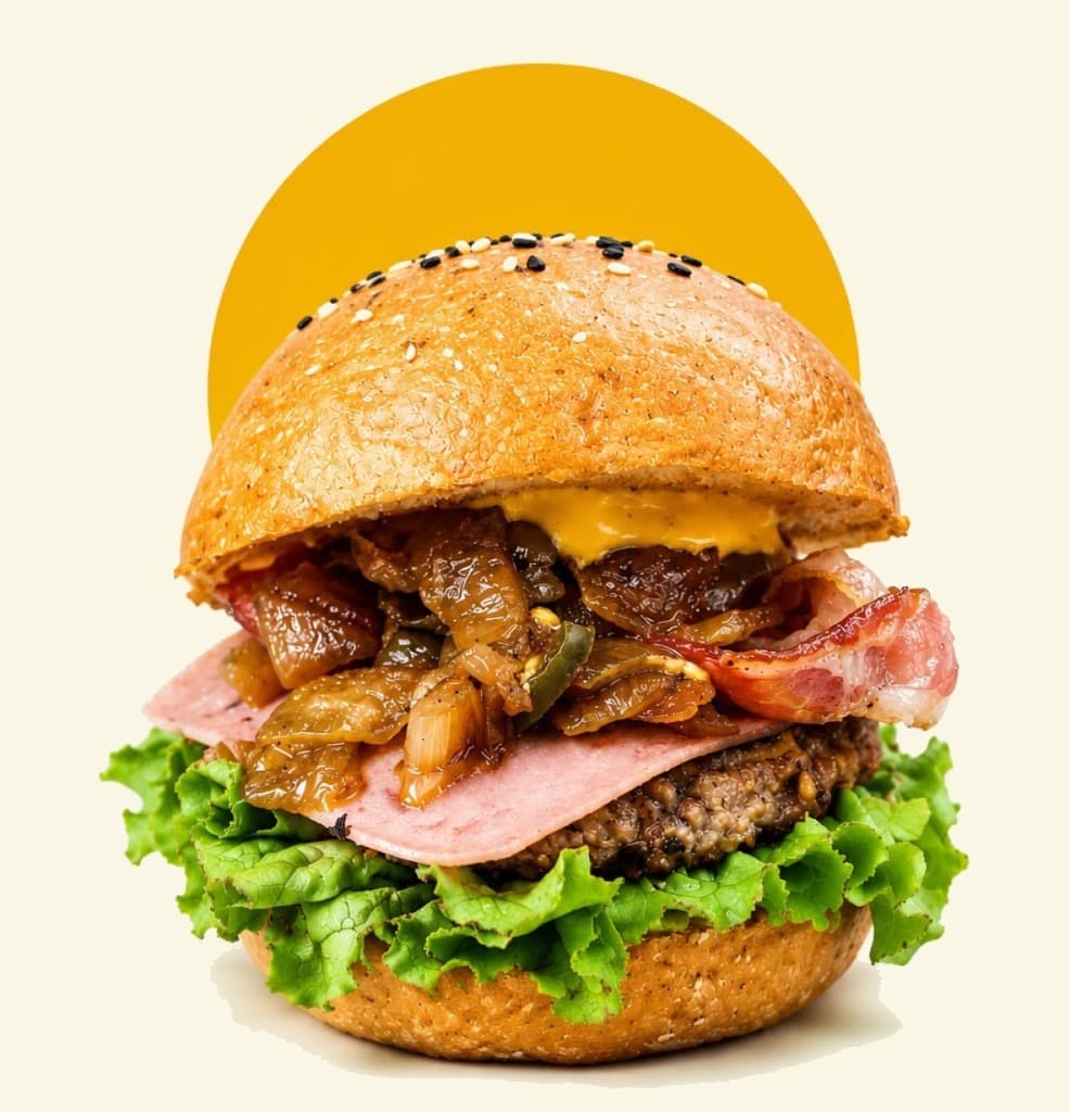 Hamburguesa Mad Dogos con queso, jamón, tocino y cebolla asada